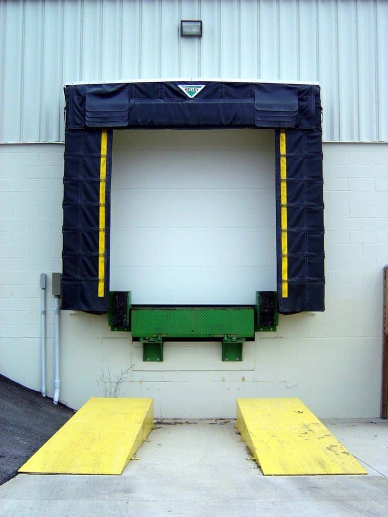 Dock Door With Dock Leveler