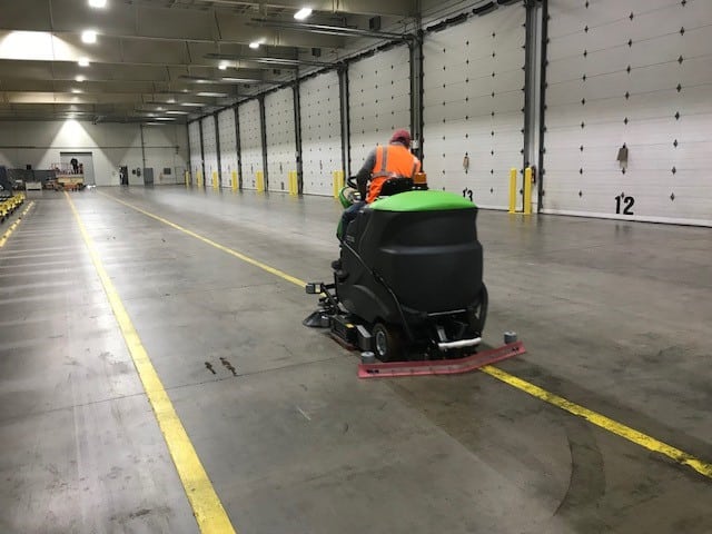 IPC Eagle Floor Scrubbers and Sweepers Cleaning a Warehouse