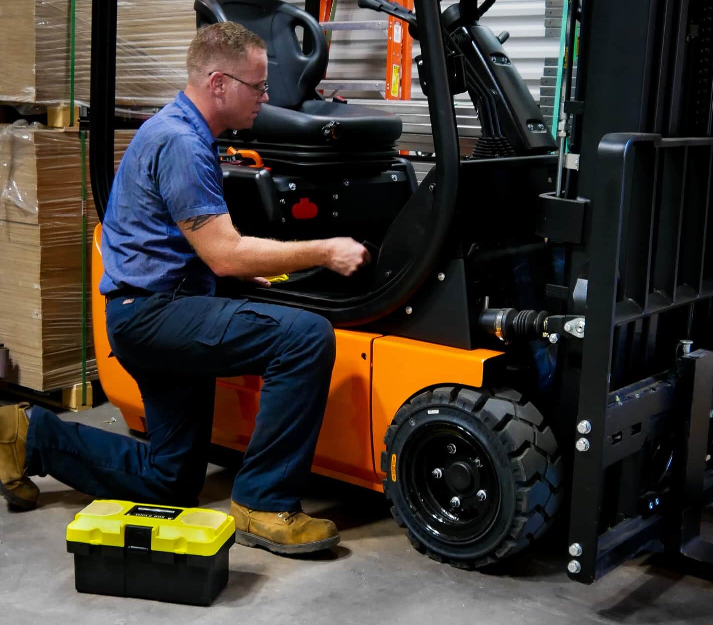 Forklift Technician Repairing a Forklift